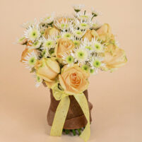 Apricot Snowburst bouquet with apricot-peach roses, white spider chrysanthemums, jute wrap, and pastel yellow ribbon by Rapid Petals by Yashken Fresh