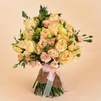 Ivory Peach Charm bouquet with ivory-peach roses, blush blooms, green buds, jute wrap, and pink ribbon by Rapid Petals by Yashken Fresh