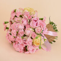 Soft Pink Elegance bouquet with pink roses, pink carnations, cream rose accents, jute wrap, and pink ribbon by Rapid Petals by Yashken Fresh
