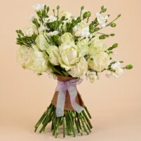 White Whisper Bloom white rose bouquet with ivory-white roses, delicate white spray blooms, jute wrap, and lavender ribbon by Rapid Petals by Yashken Fresh